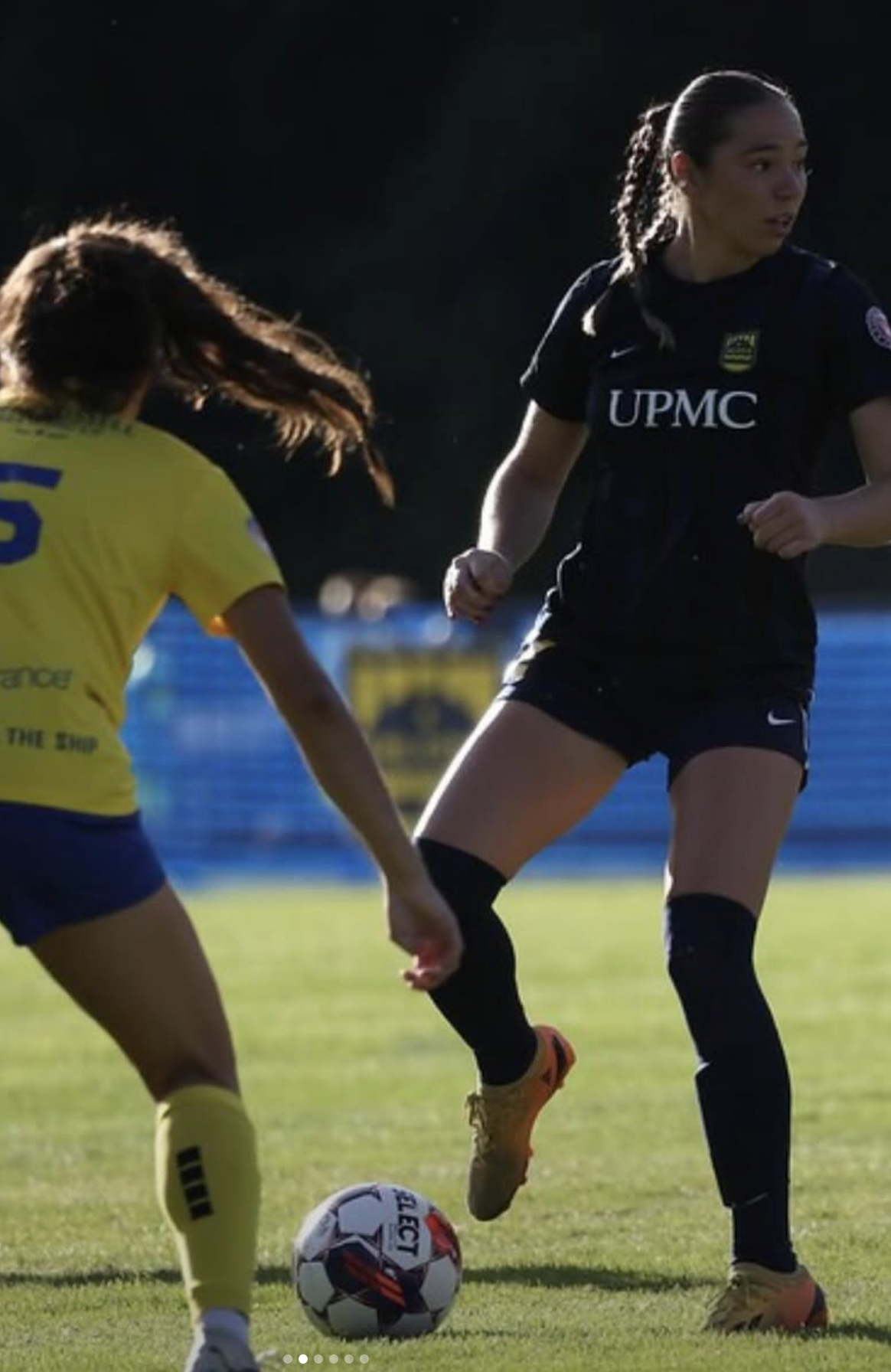 Mary competing in soccer match